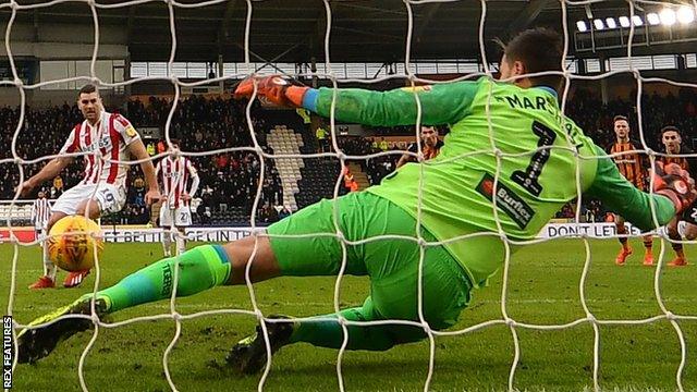 Hull City goalkeeper David Marshall does well to save Sam Vokes' penalty