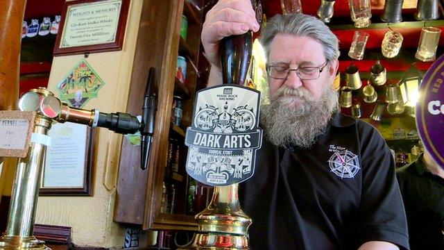 Man pulling a pint in a pub