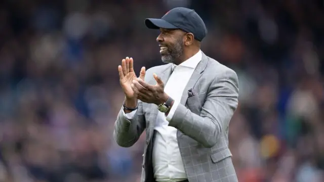 Lucas Radebe, former Leeds United and South Africa captain, applauds the crowd