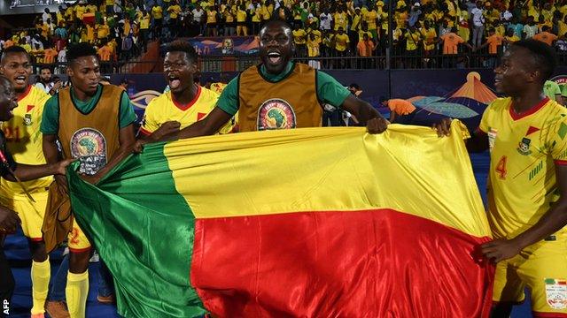 Benin's players celebrate after beating Morocco at the Africa Cup of Nations