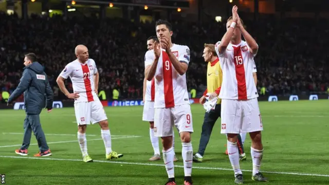 The Polish fans applaud the supporters at Hampden after their last-gasp goal earned them a point