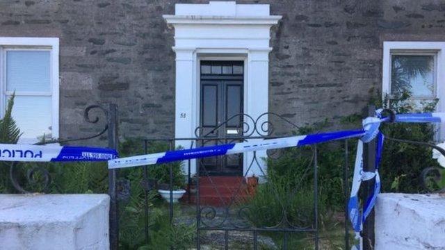 Police tape outside house