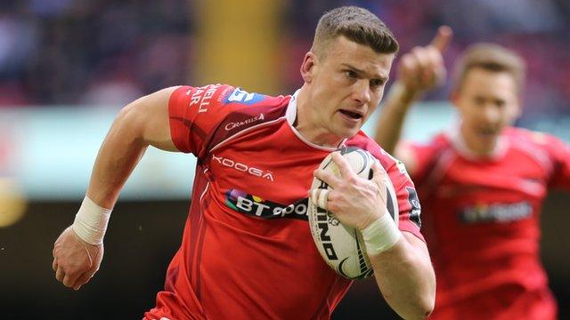 Scott Williams of the Scarlets scores the game's first try against Newport Gwent Dragons
