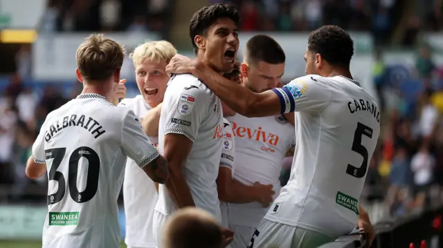 Swansea City players celebrate