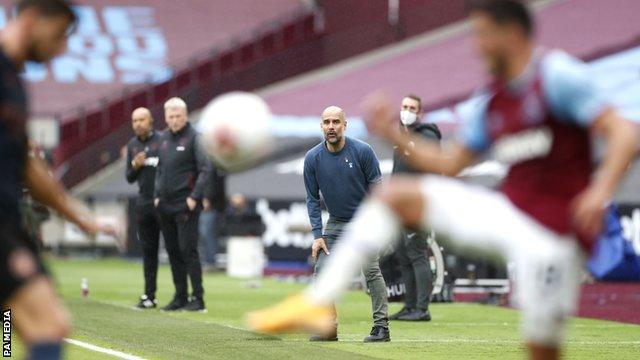 Pep Guardiola looks on during Manchester City's 1-1 draw at West Ham