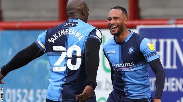 Jordan Obita (right) celebrates with Wycombe Wanderers