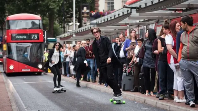 Two skaters were taking part in a promotional event by Penny Skateboards, giving free boards to stranded commuters