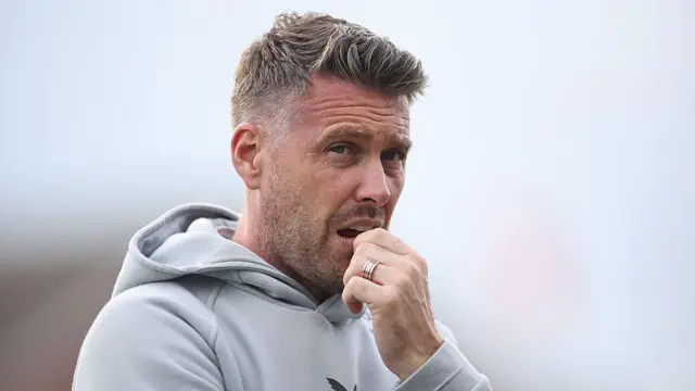 New Wolves manager Rob Edwards looks deep in thought