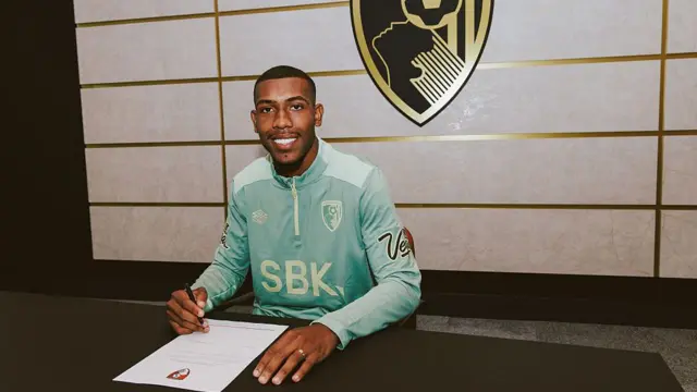 Image of Rayan signing contract for Bournemouth