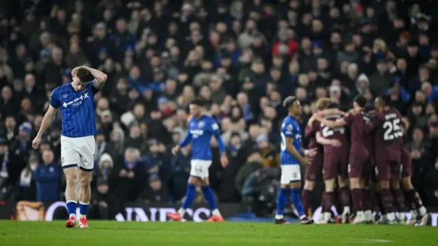 Ipswich players look dejected as they concede against Manchester City 