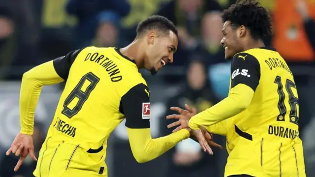 Borussia Dortmund midfielder Felix Nmecha (left) celebrates