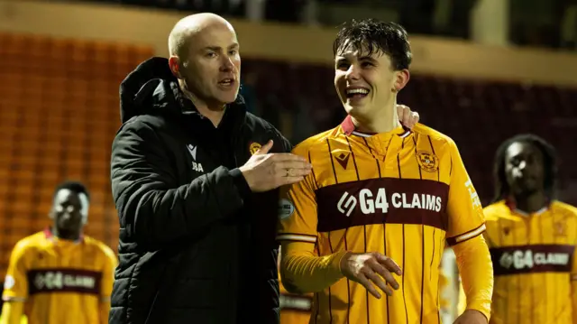 Motherwell's Jens Berthel Askou (L) and Tom Sparrow