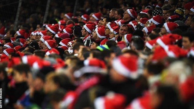 Fans got into the festive spirit by wearing Santa hats during the game between Freiburg and RB Leipzig