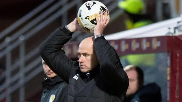 Motherwell manager Jens Berthel Askou throws the ball