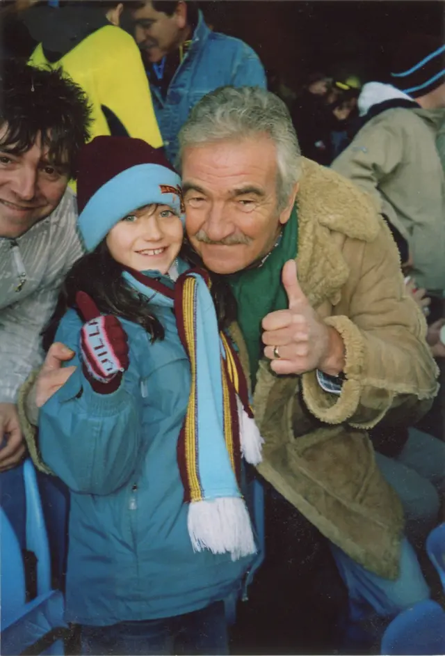 Alan's daughter Esme and uncle Ken at a Villa game in a Villa scarf and hat.