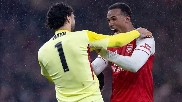David Raya of Arsenal celebrates with Gabriel of Arsenal after their sides victory