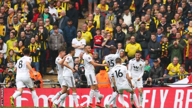 Watford fans watch on as Wolves celebrates the opening goal