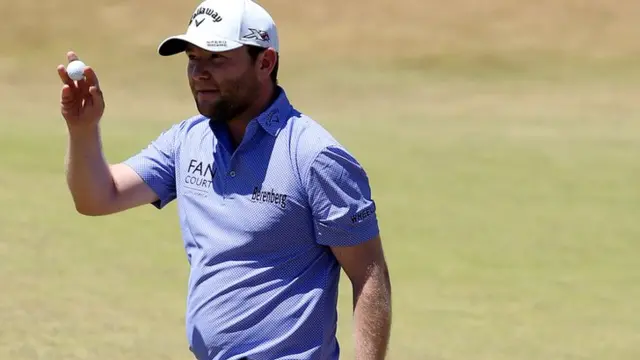 Branden Grace waves on the 18th