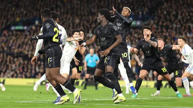 Pascal Struijk of Leeds United goes down in the opponent's box following a tussle with Luke O'Nien as other players challenge for a corner