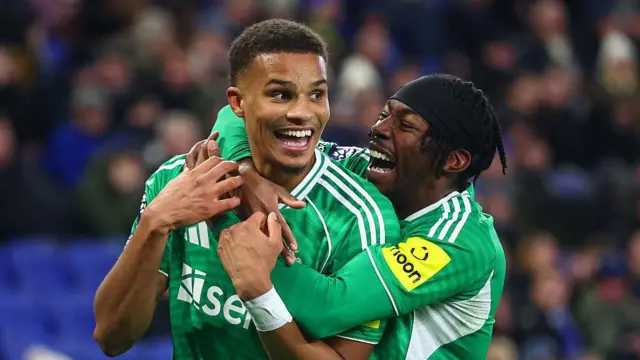 Malick Thiaw of Newcastle United celebrates scoring his side's fourth goal with team-mate Anthony Elanga