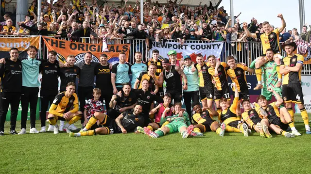 Newport County players and staff celebrate with fans