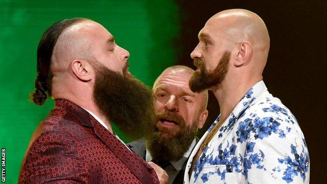 Braun Strowman squaring up to Tyson Fury