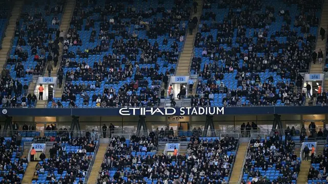 Empty seats in the Etihad Stadium as fans protest high ticket prices 