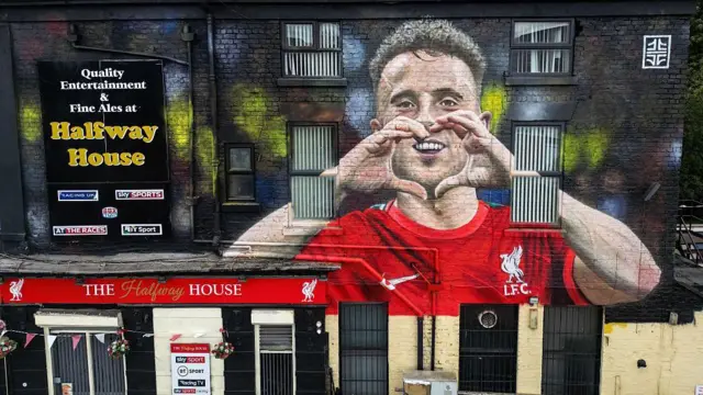 The mural is shown on the side of the Halfway House pub