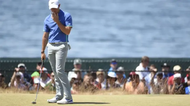 Rory McIlroy reacts after missing a putt