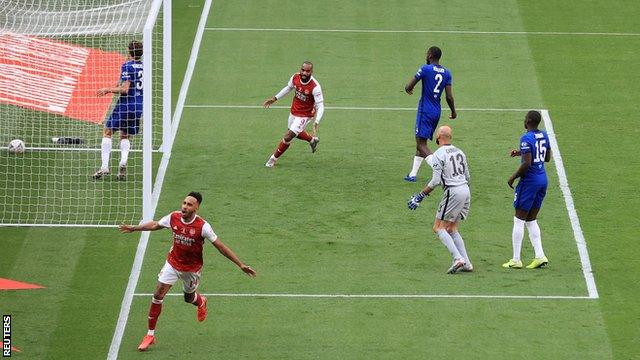 Pierre-Emerick Aubameyang wheels away in celebration after hitting Arsenal's winner against Chelsea