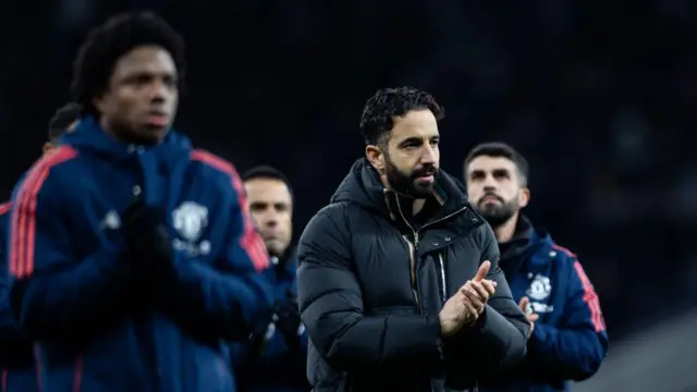 Manchester United's manager Ruben Amorim applauds his side's travelling supporters