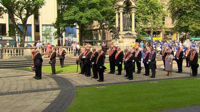 The parade stopped at Belfast's City Hall to allow Orangemen to lay a wreath at the Cenotaph.