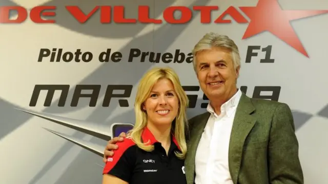 Marussia driver Maria De Villota of Spain poses next to her father former formula one driver Emilio de Villota