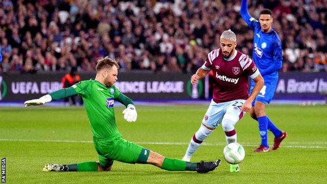 Silkeborg keeper Nicolai Larsen blocks a shot from West Ham's Said Benrahma