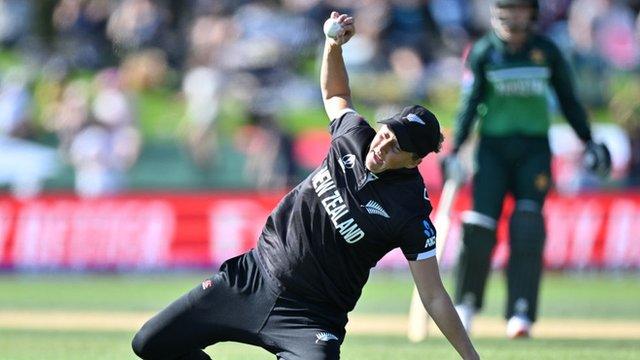 Sophie Devine catches a ball