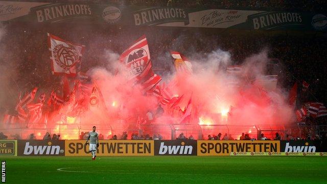 Bayern Munich fans set off flares and waved flags