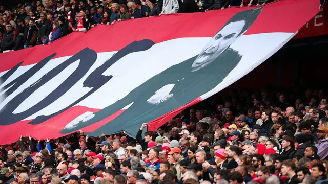 A banner in the Arsenal crowd of Mikel Arteta celebrating and the end of the word "Vamos"