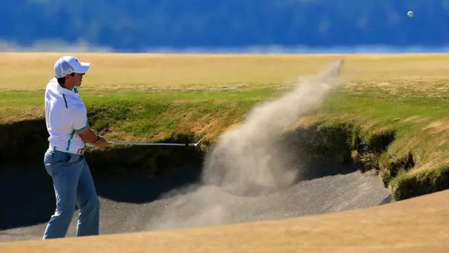 Rory McIlroy is in the bunker