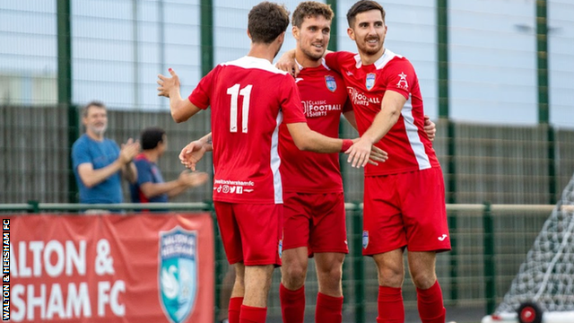 Walton & Herham's players celebrate a goal