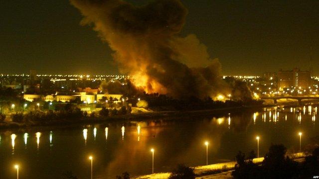 Smoke billows as a missile hits the Iraqi planning ministry in Baghdad on 20 March 2003