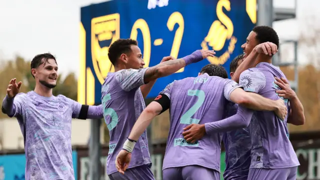 Swansea players celebrate Florian Bianchini's goal