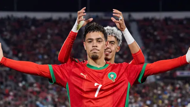 A picture of Morocco's Othmane Maamma celebrating with team-mate Yassir Zabiri