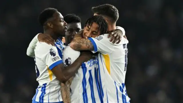 Danny Welbeck in a huddle with his Brighton team-mates