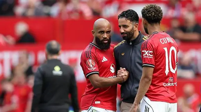Bryan Mbeumo and Matheus Cunha of Manchester United interact with Ruben Amorim