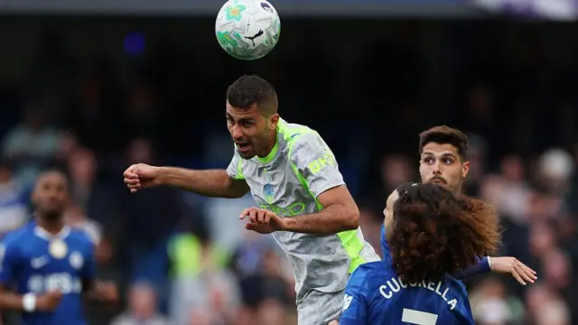 Rodri leaps to head a ball for Man City against Chelsea
