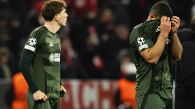 Celtic's Cameron Carter-Vickers is dejected during the UEFA Champions League 2024/25 League Knockout Play-off second leg match between FC Bayern Munich and Celtic at the Allianz Arena