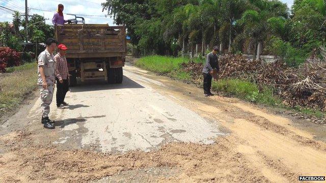 Potholes being repaired in Thailand