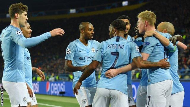 Manchester City's players celebrate scoring against Shakhtar Donetsk in the Champions League