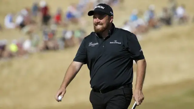 Shane Lowry reacts after his putt