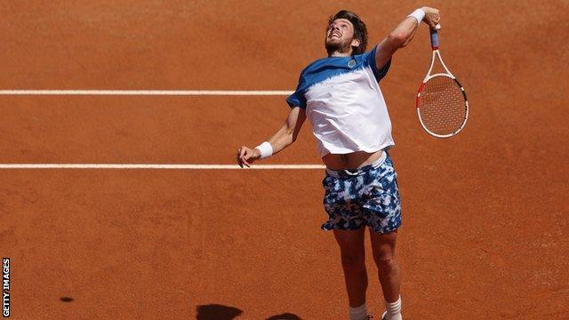 Cameron Norrie looks to hit the ball